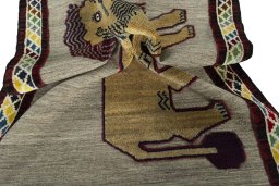 Corner detail of 2000s Persian Gabbeh rug showing border pattern and Wool pile