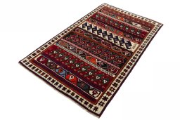 Corner detail of 2000s Persian Gabbeh rug showing border pattern and Wool pile