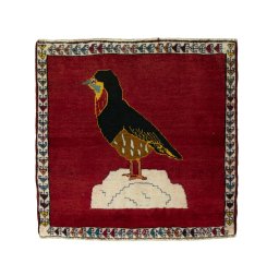 Full view of 2000s Persian Gabbeh rug from Iran / Persia, 73 × 76 cm in Red tones