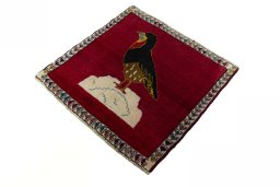 Corner detail of 2000s Persian Gabbeh rug showing border pattern and Wool pile