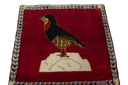 Surface texture of 2000s Persian Gabbeh rug with natural Wool and intricate pattern