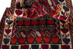 Corner detail of 2000s Persian Gabbeh rug showing border pattern and Wool pile