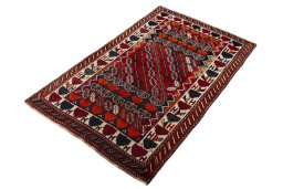Corner detail of 2000s Persian Gabbeh rug showing border pattern and Wool pile