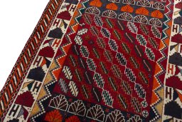 Backside of handmade 2000s Persian Gabbeh rug showing knot structure and weave density
