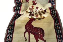 Corner detail of 2000s Persian Gabbeh rug showing border pattern and Wool pile