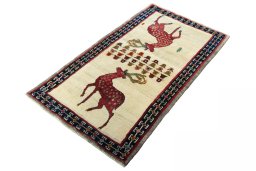 Corner detail of 2000s Persian Gabbeh rug showing border pattern and Wool pile
