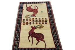 Surface texture of 2000s Persian Gabbeh rug with natural Wool and intricate pattern