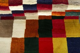 Full view of 2000s Persian Gabbeh rug from Iran / Persia, 187 × 105 cm in Multi Color tones