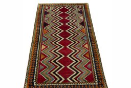 Surface texture of 2000s Persian Gabbeh rug with natural Wool and intricate pattern