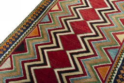 Backside of handmade 2000s Persian Gabbeh rug showing knot structure and weave density