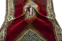 Corner detail of 2000s Persian Gabbeh rug showing border pattern and Wool pile