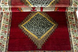 Full view of 2000s Persian Gabbeh rug from Iran / Persia, 198 × 105 cm in Red tones