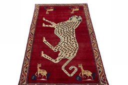 Surface texture of 2000s Persian Gabbeh rug with natural Wool and intricate pattern