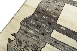Backside of handmade 2000s Persian Gabbeh rug showing knot structure and weave density