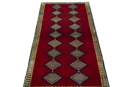 Surface texture of 2000s Persian Gabbeh rug with natural Wool and intricate pattern