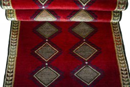 Full view of 2000s Persian Gabbeh rug from Iran / Persia, 205 × 101 cm in Red tones