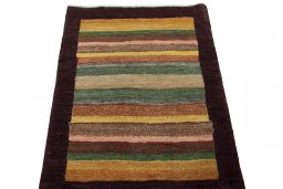 Surface texture of 2000s Persian Gabbeh rug with natural Wool and intricate pattern