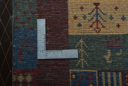 Close-up detail of 2000s Persian Gabbeh rug from Iran / Persia showing Wool weave