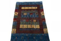 Surface texture of 2000s Persian Gabbeh rug with natural Wool and intricate pattern