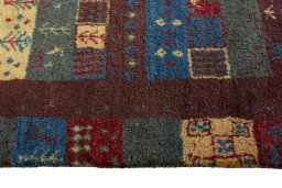 Close-up detail of 2000s Persian Gabbeh rug from Iran / Persia showing Wool weave