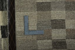Close-up detail of 2000s Persian Gabbeh rug from Iran / Persia showing Wool weave