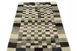 Surface texture of 2000s Persian Gabbeh rug with natural Wool and intricate pattern