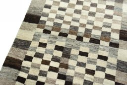 Backside of handmade 2000s Persian Gabbeh rug showing knot structure and weave density
