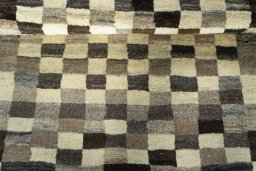 Full view of 2000s Persian Gabbeh rug from Iran / Persia, 146 × 105 cm in Beige tones