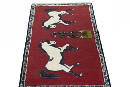 Surface texture of 2000s Persian Gabbeh rug with natural Wool and intricate pattern