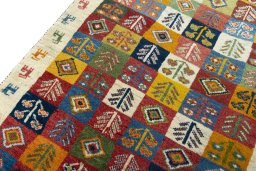 Backside of handmade 2000s Persian Gabbeh rug showing knot structure and weave density