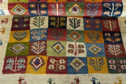 Full view of 2000s Persian Gabbeh rug from Iran / Persia, 144 × 100 cm in Multi Color tones