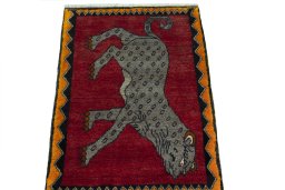 Surface texture of 2000s Persian Gabbeh rug with natural Wool and intricate pattern