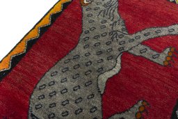 Backside of handmade 2000s Persian Gabbeh rug showing knot structure and weave density