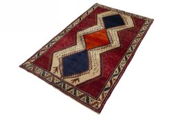 Corner detail of 2000s Persian Gabbeh rug showing border pattern and Wool pile