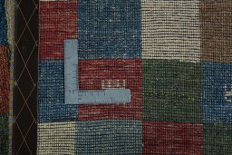 Close-up detail of 2000s Persian Gabbeh rug from Iran / Persia showing Wool weave