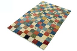 Corner detail of 2000s Persian Gabbeh rug showing border pattern and Wool pile