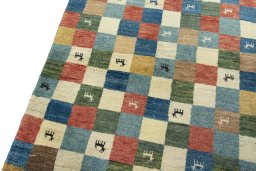 Backside of handmade 2000s Persian Gabbeh rug showing knot structure and weave density