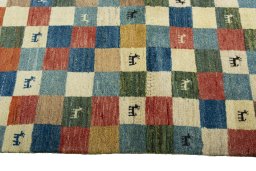 Close-up detail of 2000s Persian Gabbeh rug from Iran / Persia showing Wool weave