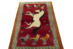 Surface texture of 2000s Persian Gabbeh rug with natural Wool and intricate pattern
