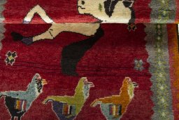 Full view of 2000s Persian Gabbeh rug from Iran / Persia, 173 × 105 cm in Red tones