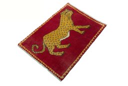 Corner detail of 2000s Persian Gabbeh rug showing border pattern and Wool pile