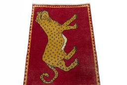Surface texture of 2000s Persian Gabbeh rug with natural Wool and intricate pattern