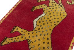 Backside of handmade 2000s Persian Gabbeh rug showing knot structure and weave density