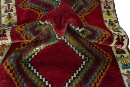Corner detail of 2000s Persian Gabbeh rug showing border pattern and Wool pile
