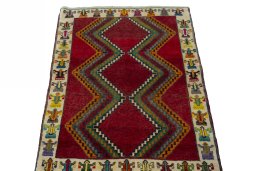 Surface texture of 2000s Persian Gabbeh rug with natural Wool and intricate pattern