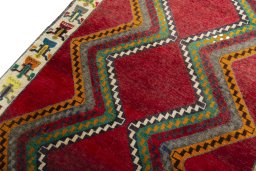 Backside of handmade 2000s Persian Gabbeh rug showing knot structure and weave density