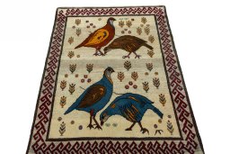Surface texture of 2000s Persian Gabbeh rug with natural Wool and intricate pattern