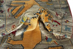 Corner detail of 2000s Persian Gabbeh rug showing border pattern and Wool pile