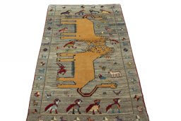 Surface texture of 2000s Persian Gabbeh rug with natural Wool and intricate pattern