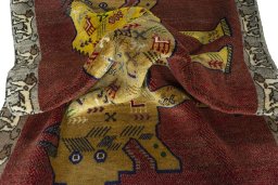 Corner detail of 2000s Persian Gabbeh rug showing border pattern and Wool pile